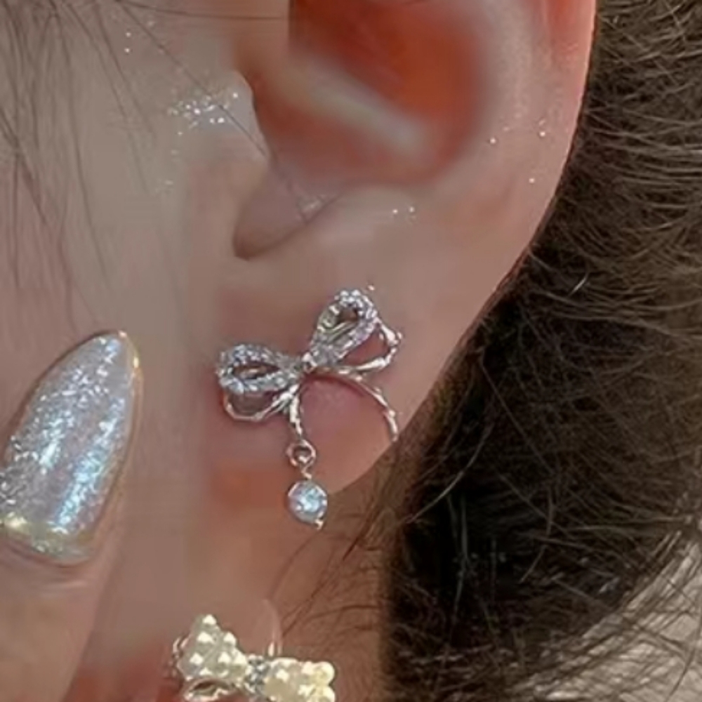 Brand new Delicate Hollow Bow shaped stud earrings.